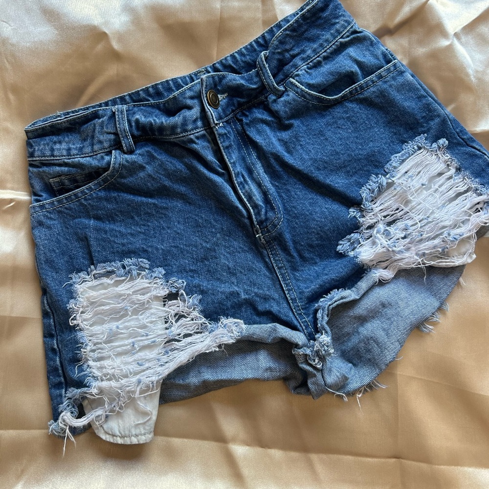 Fashion Nova Denim shorts. Blue wash. Distressed pockets. Size 1
